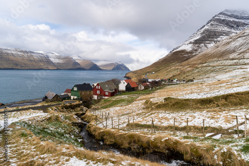 View of the Kunoy, small village situated on the slope of a hill in Faroe Islands photo