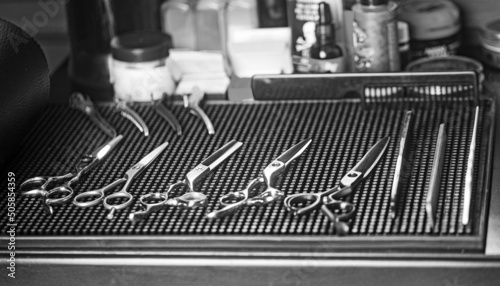 Barbershop background for men, beauty salon. Hairdresser tools scissors, razor, comb, copy space.