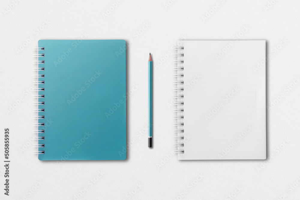 blue notebook and pencil placed on white paper background blue notebook and pencil placed on white paper background