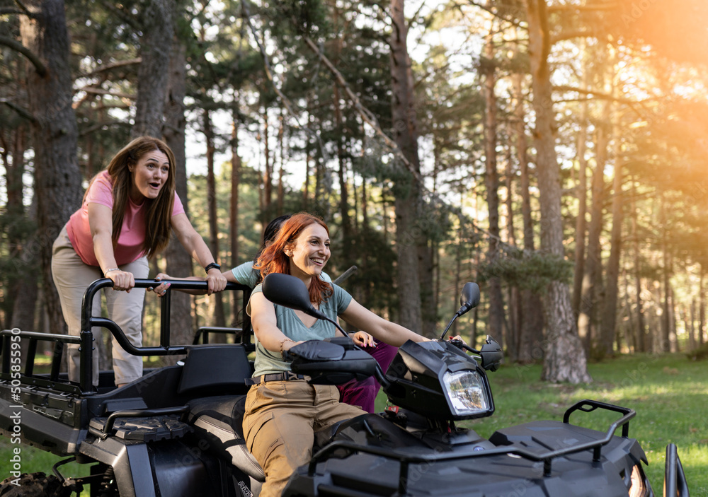 Ταπετσαρία three mature women on quad bikes driving in nature, enjoying the trip happy feel