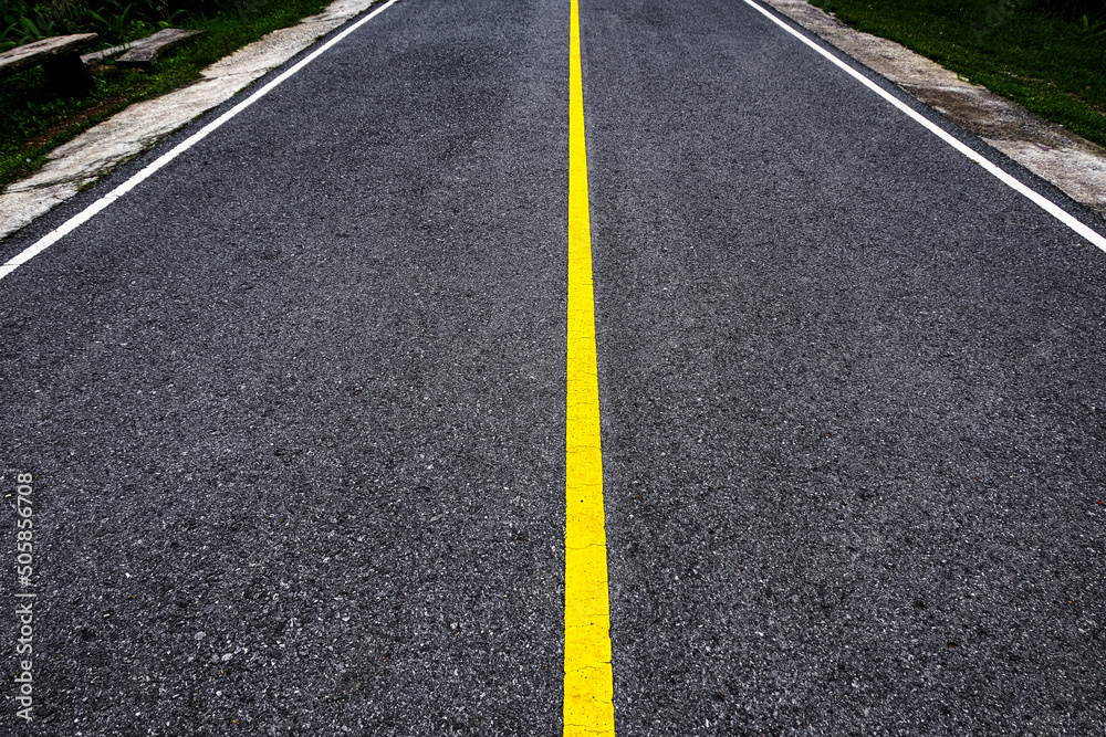 lines on the road. Asphalt road with yellow traffic line. Transportation concept. Road texture background.