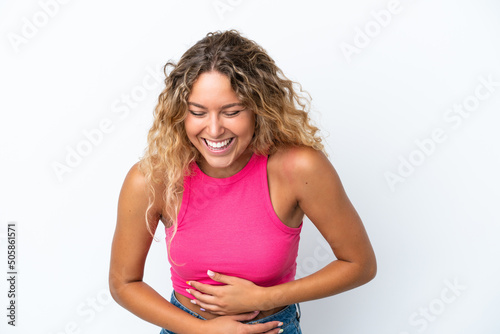 Girl with curly hair isolated on white background smiling a lot