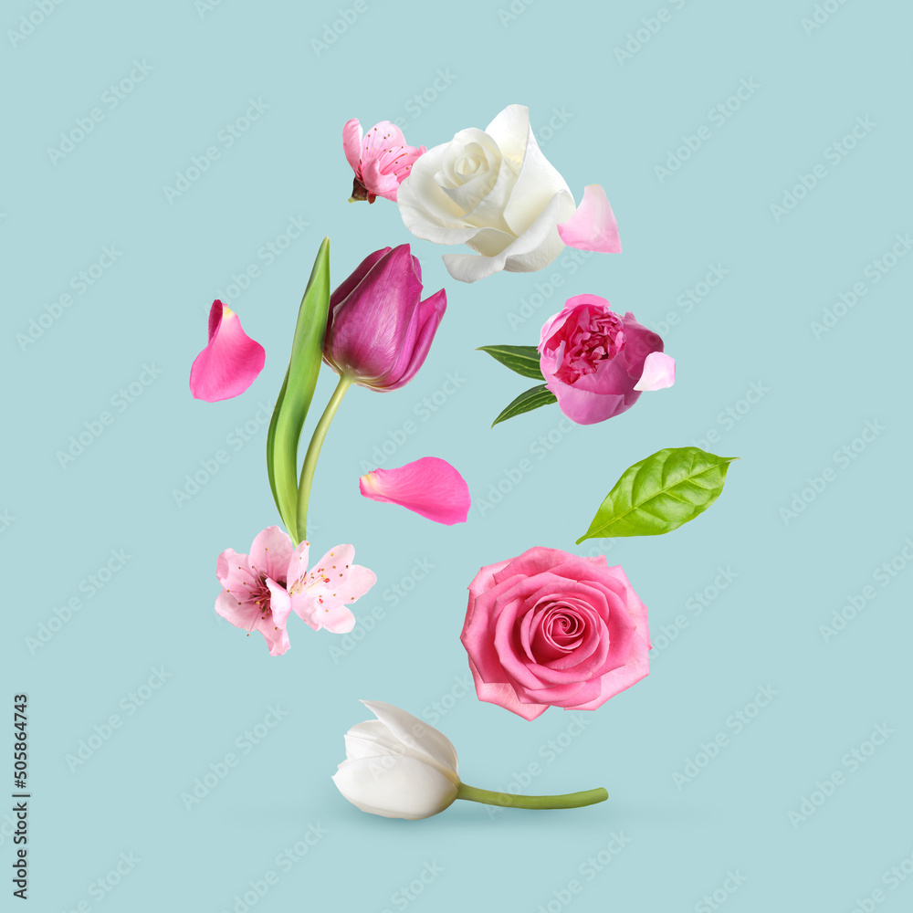 Different beautiful flowers flying on turquoise background