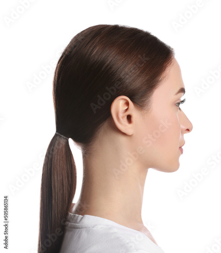 Profile portrait of young woman on white background photo