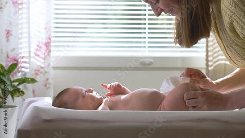 A baby boy suddenly starting to pee during a diaper change