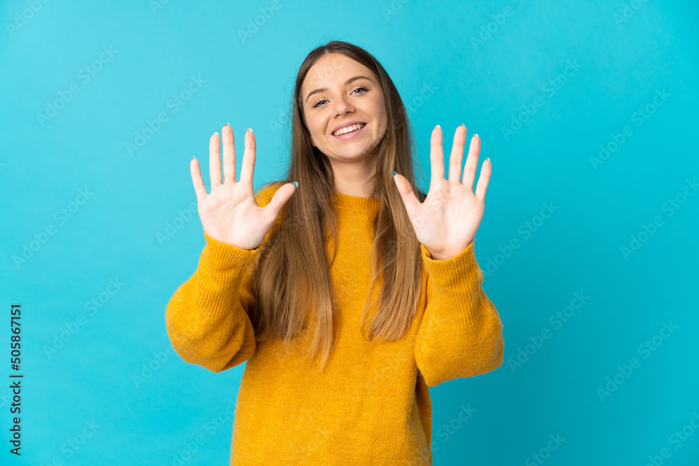 Young Lithuanian woman isolated on blue background counting ten with fingers Young Lithuanian woman isolated on blue background counting ten with fingers