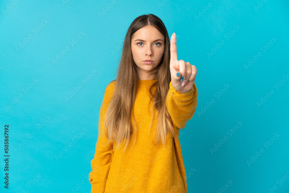Young Lithuanian woman isolated on blue background counting one with serious expression Young Lithuanian woman isolated on blue background counting one with serious expression