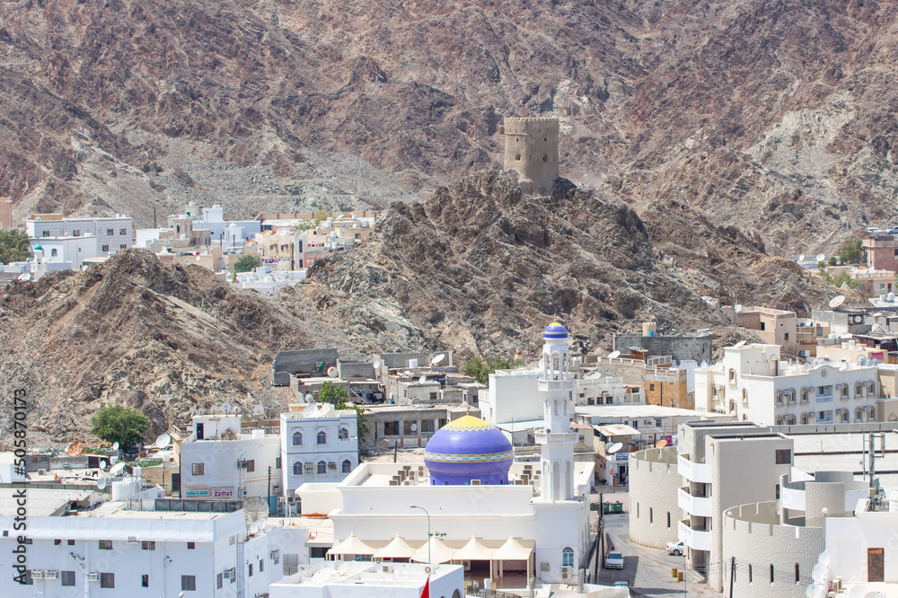 Muscat, Oman - capital and most populated city in Oman, Muscat displays amazing spots where its white buildings are surrounded by impressive mountains and rock formations