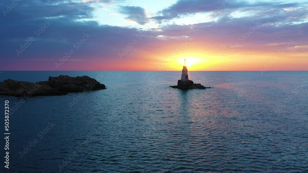 Flight over a sunny path to a lighthouse on an island and a beautiful sunrise. Ahtopol, Bulgaria. 4K Flight over a sunny path to a lighthouse on an island and a beautiful sunrise. Ahtopol, Bulgaria. 4K