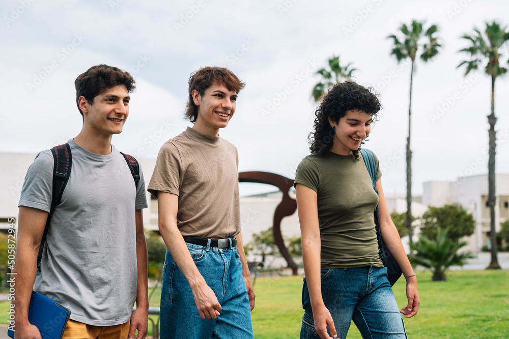Group of college students walking on campus