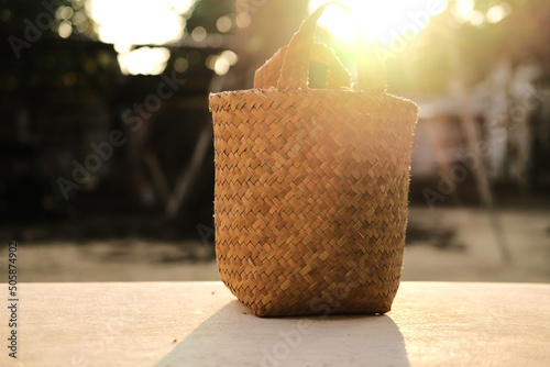 Basket made of pandan leaves with sunlight. Rural communities use pandan leaves to make handicrafts to create value for local materials photo