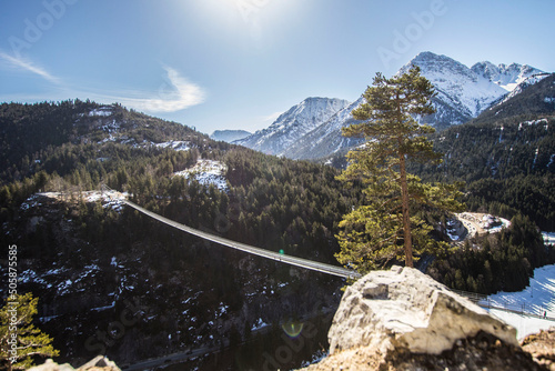 Hanging bridge Highline 179 in Reutte, the longest rope bridge in the world (406 meters long and 114 meters high) with mountain background, Reutte, Austria photo