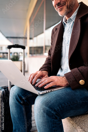 Close up of an unrecognizable business man using laptop. © santypan