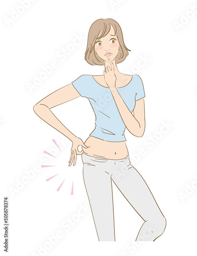 お腹の脂肪を気にする可愛い女性
