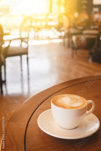 coffee latte art on the wood desk in coffee shop cafe