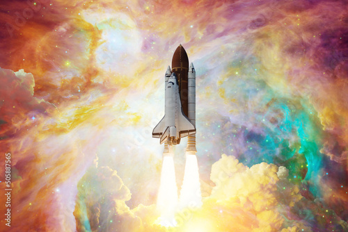 Fototapeta Naklejka Na Ścianę i Meble -  Spaceship flight. Space shuttle with smoke and blast takes off into the starry sky and clouds of gas or dust in space. Rocket starts into nebula. Concept. Elements of this image furnished by NASA.