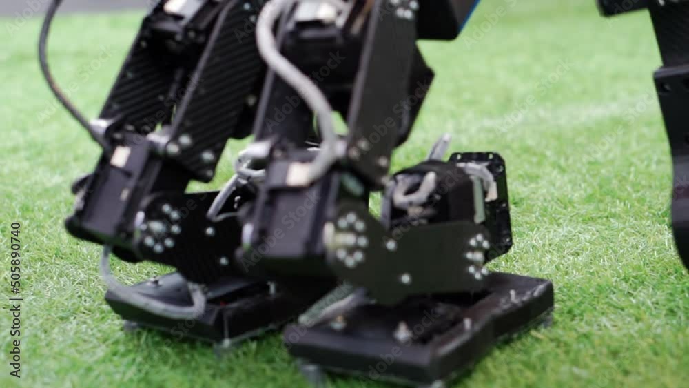 Homemade controlled robot on green grass. Homemade controlled robot on green grass.