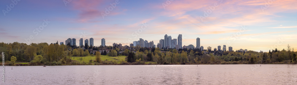 Obraz premium Scenic view of a modern city park by the lake. Spring Season. Deer Lake, Burnaby, Vancouver, British Columbia, Canada. Panorama. Sunset Sky Art Render