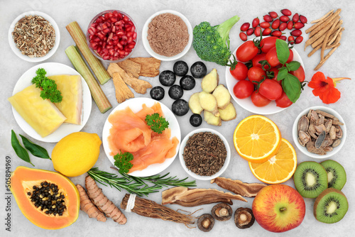 Health food collection for immune system boost with seafood, vegetables, fruit, medicinal herbs, spice. Very high in antioxidants, anthocyanins, protein, fibre, vitamins, minerals, omega 3.  photo