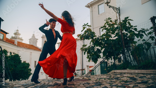 Beautiful Couple Dancing a Latin Dance on the Quiet Street of an Old Town in a City. Sensual Dance by Two Professional Dancers on a Sunny Day Outside in Ancient Culturally Rich Tourist Location.