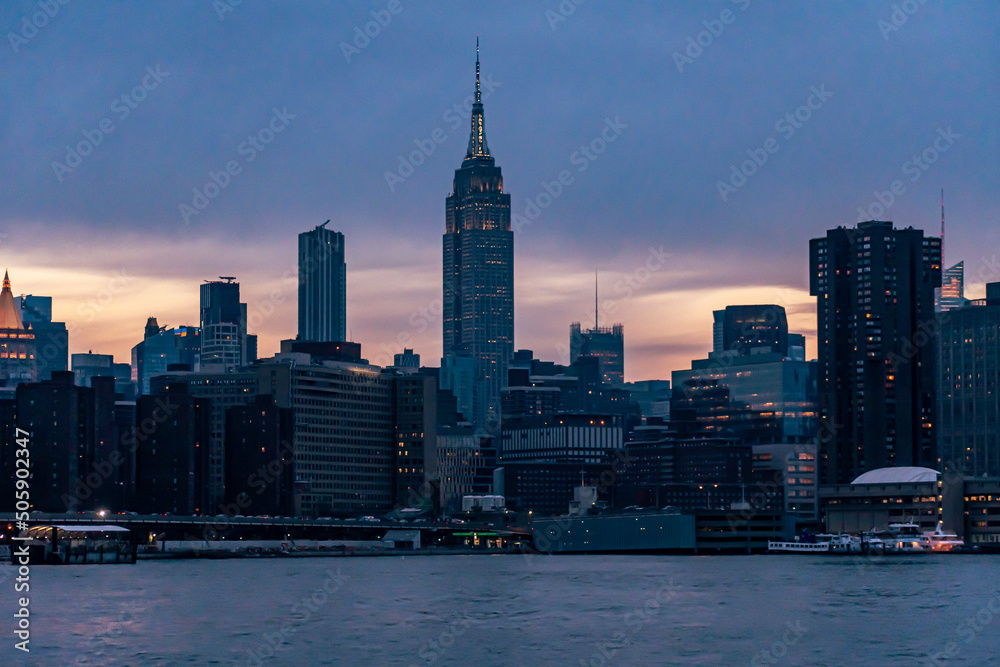 The Empire State Building, Waterside plaza and Midtown Manhattan at sunset from the east river.