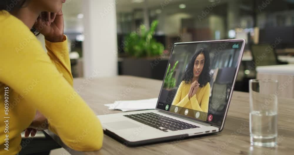 Video of african american woman having video call on laptop with biracial female coworker Video of african american woman having video call on laptop with biracial female coworker