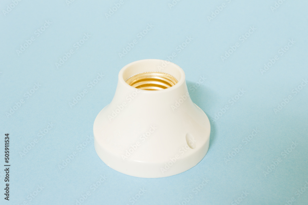 Lamp holder on blue background, isolated.