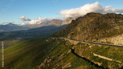 Majestic asphalt road on mountain side in South Africa, aerial drone view photo