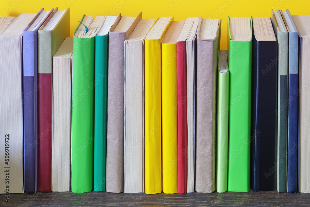 Different colorful books on bookshelf. Copy space Different colorful books on bookshelf. Copy space