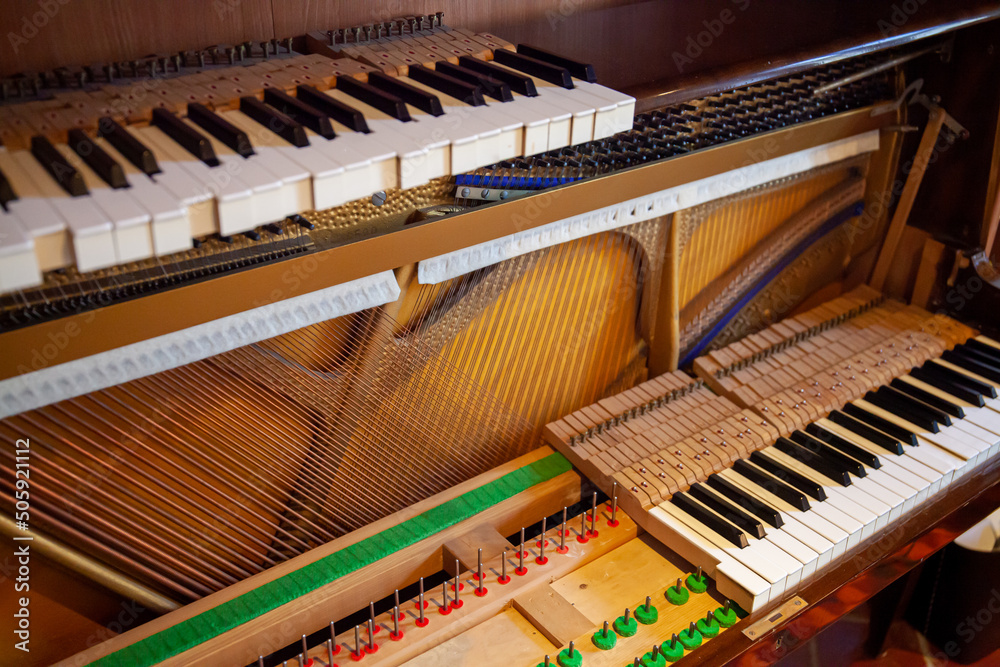 Disassembled upright piano for regulation, cleaning, repair. Interior