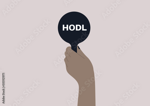 An isolated hand holding a bid with a HODL sign on it, online auction, new technologies and money investment