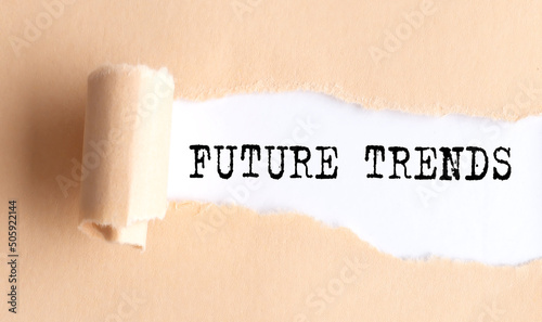 The text FUTURE TRENDS appears on torn paper on white background.