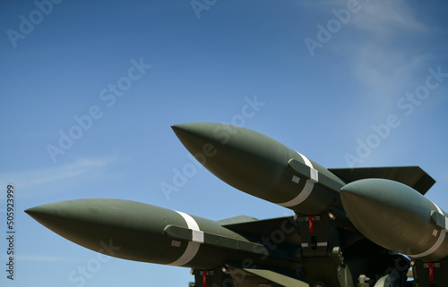 Detail view of a military rocket launch system on the field used during war. Army weapons industry.