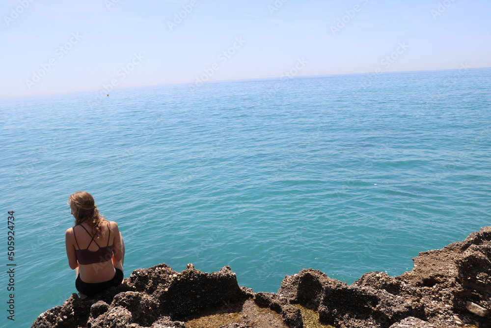 girl in front of beach