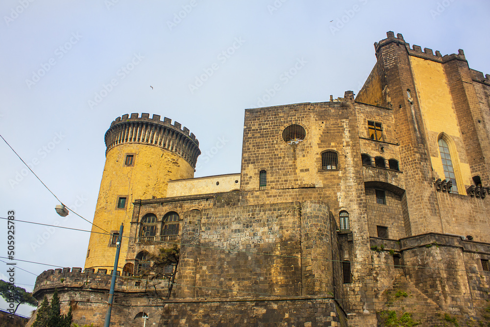 View of Nuovo Castle from the side of the port in Naples, Italy