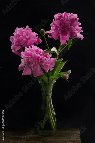 Closeup Pink Peony Flowers Bouquet In Vase photo