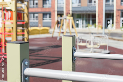 pull up bars outdoors on backyard. Sports facilities for children and adults in common areas of condos and apartment buildings