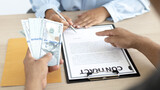 Businessmen give money dollar bribe employees sign consent documents for illegal loans, Bad plan, corruption concept...