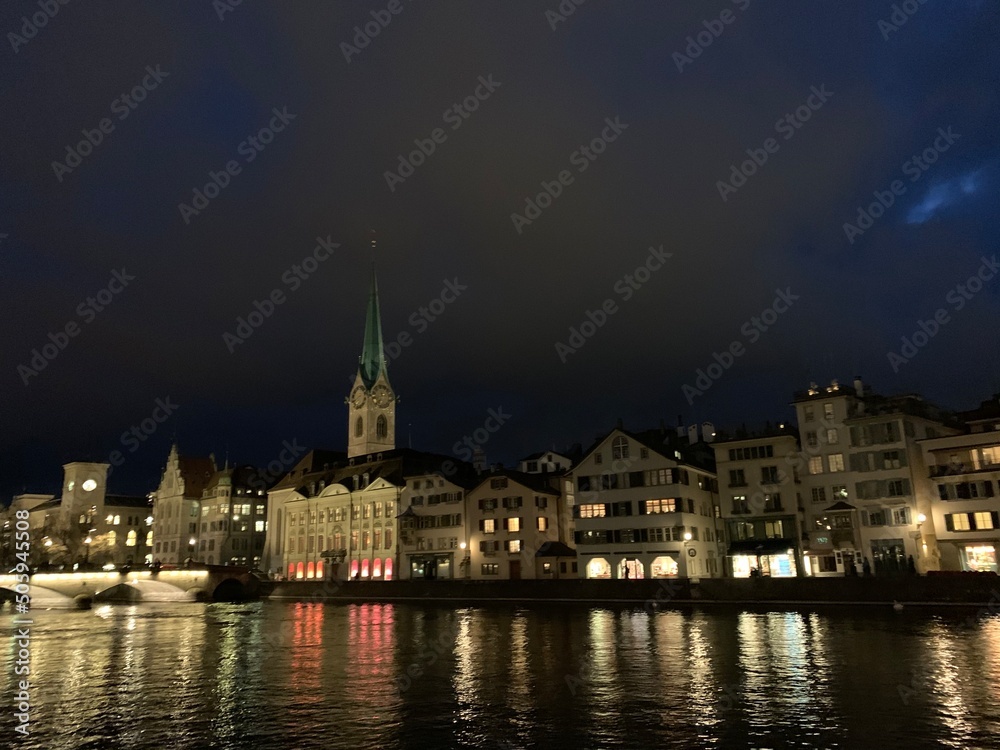 Night view of the city of Zurich with the church in the background and the night lights on the lake, Zurich, Swiss, February, 2020
