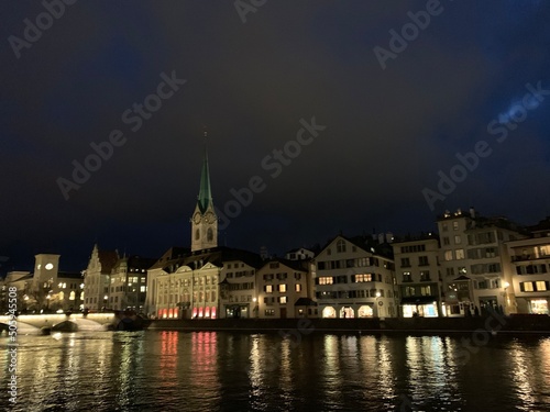 Night view of the city of Zurich with the church in the background and the night lights on the lake, Zurich, Swiss, February, 2020