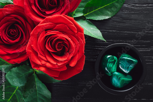 Red Roses and Malachite on Black Background photo