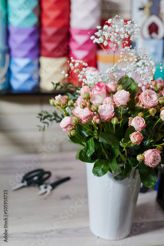 florist collects a beautiful bouquet of different flowers © st.kolesnikov