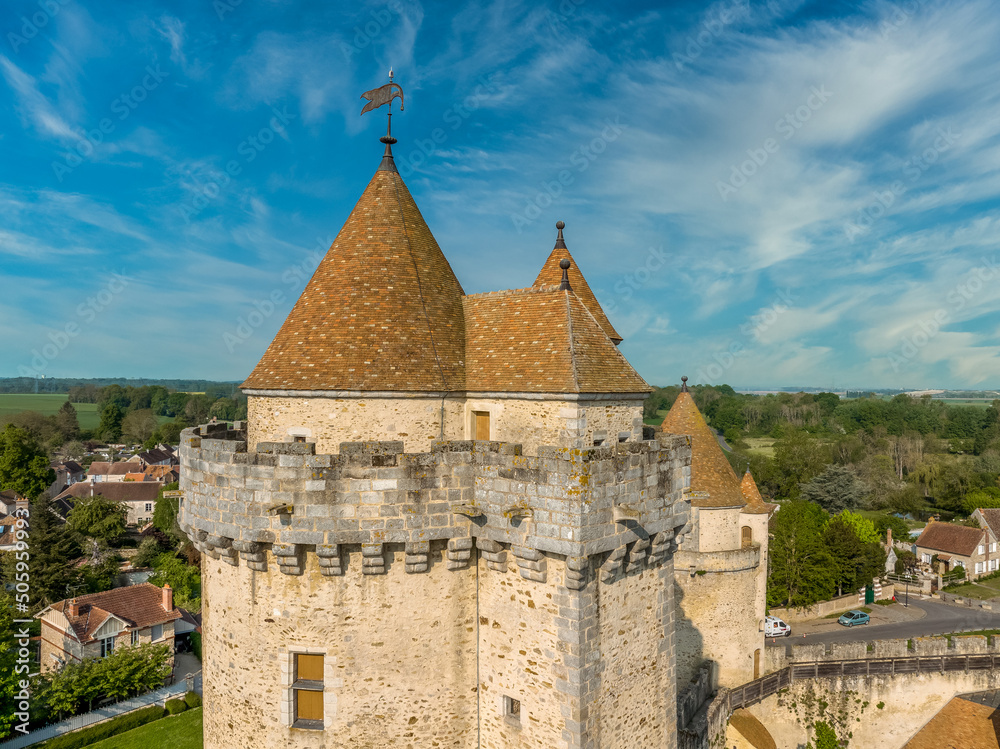 Fully restored medieval keep or donjon with red roof and battlements in Blandy les Tours Seine-et-Marne department Northern France