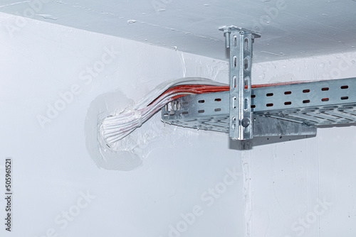 Obraz na plátne Cable sealing with fire-resistant compound at a wall penetration for electrical