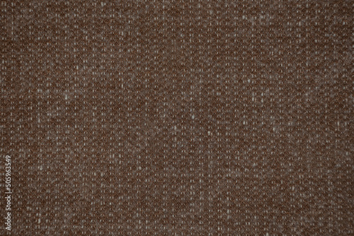 .Texture: brown fabric with white threads woven into it