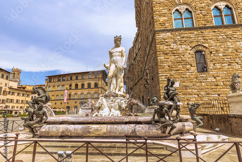 The central Square, Neptune Foutain and Palace Vecchio, in the medieval famous city of Florence, Italy photo