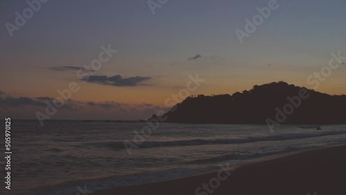 sunset of the day on the beach. la bocana beach bays of huatulco oaxaca. relaxed place. mexico beach. waves and sea.