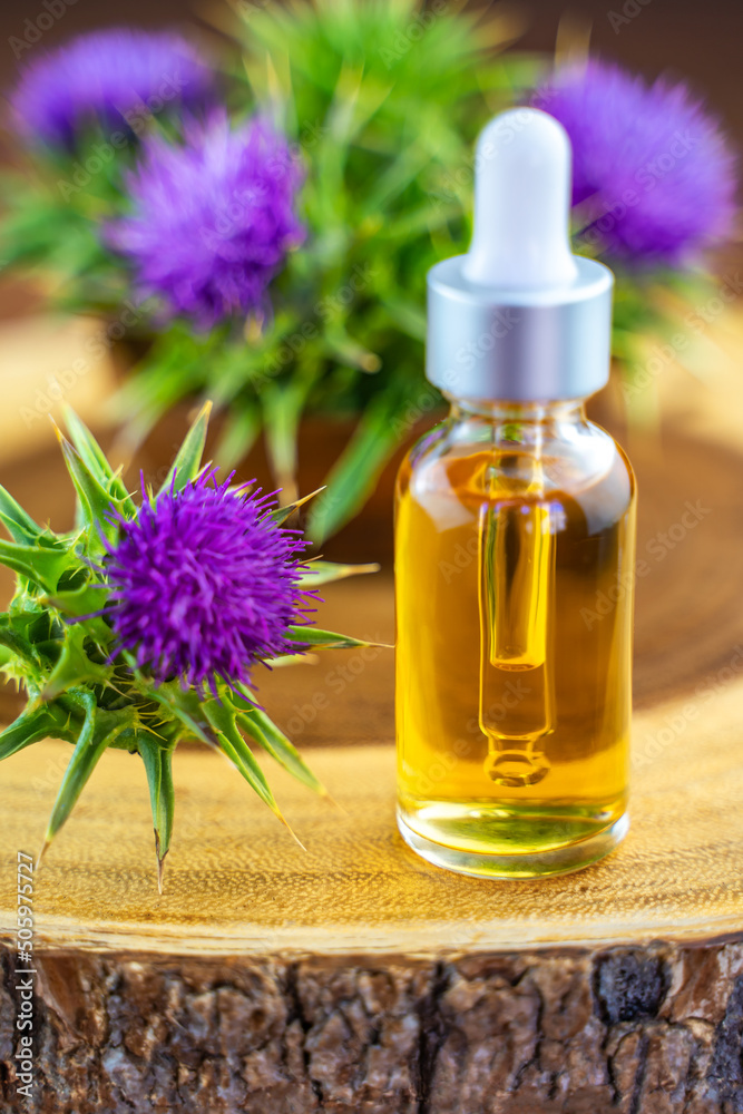 Milk thistle oil in a bottle with a pipette. Skin care. Milk thistle oil in a bottle with a pipette. Skin care.