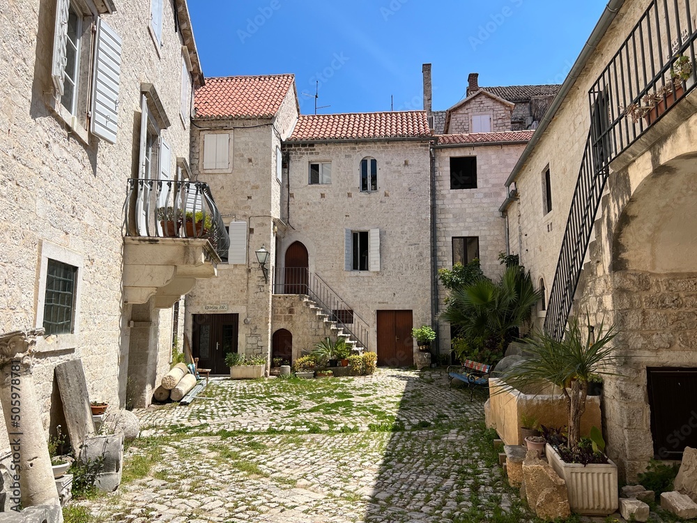 Old courtyard in Trogir, Croatia