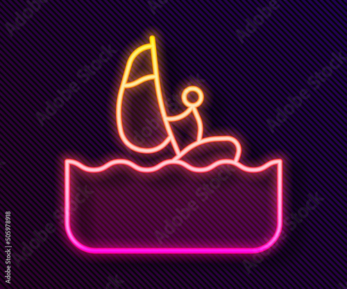 Glowing neon line Windsurfing icon isolated on black background. Vector